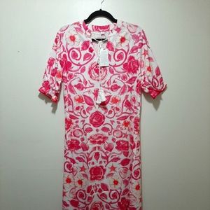 Floor length dress. White with pink flowers and white tassels